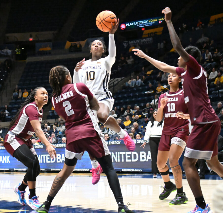Harrison tops 1,000 career points in win for WVU women